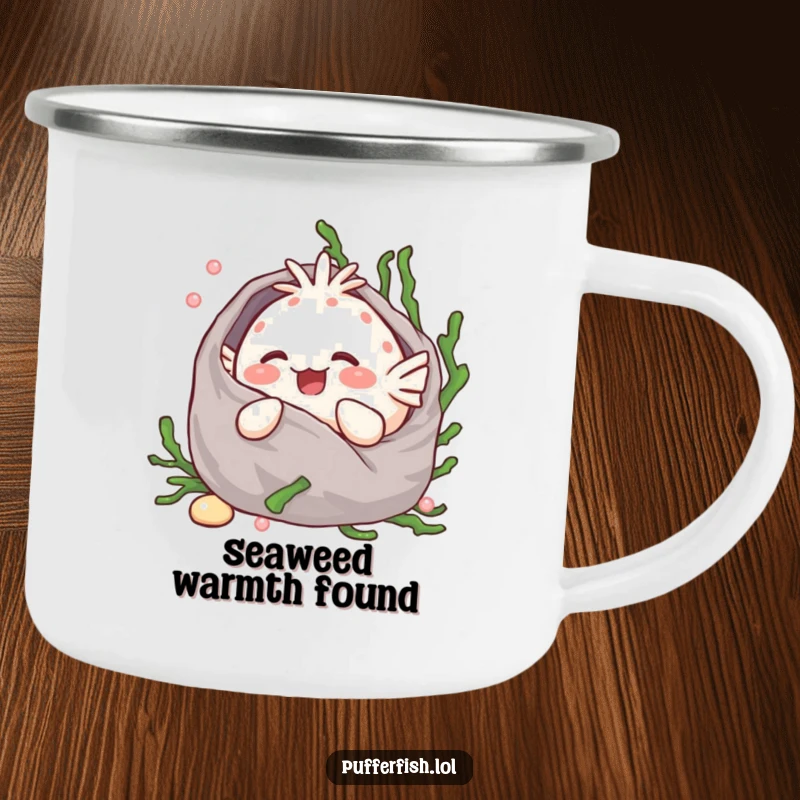 Funny Kawaii pufferfish giggling while wrapped in a seaweed blanket, sipping from a durable enamel camping mug.