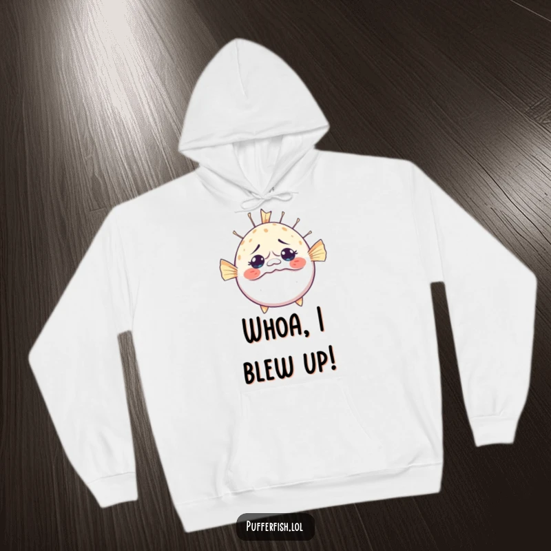 Funny Bewildered Pufferfish Hoodie: A cozy hoodie depicting a pufferfish hilariously inflating with a look of utter surprise and bewilderment.