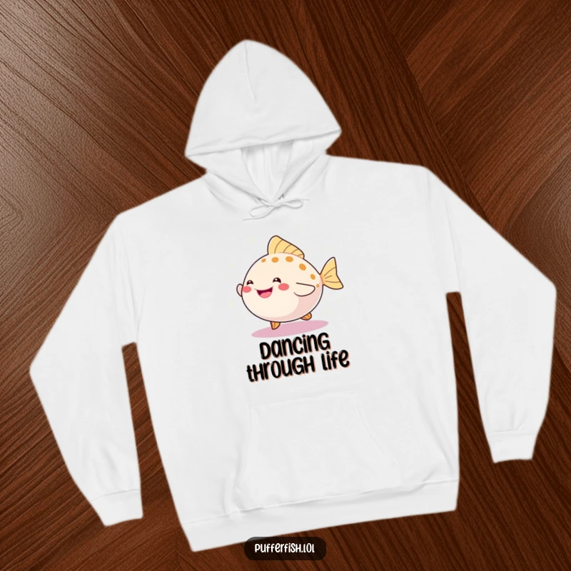 Funny hoodie featuring a happy, round pufferfish dancing with abandon amidst a cascade of glittering sparkles, embodying pure joy.