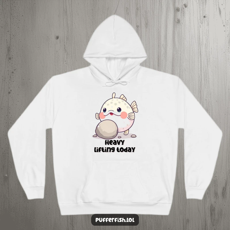 Funny Pufferfish Grit Hoodie: A warm hoodie featuring a determined pufferfish humorously pushing a large, round pebble with its nose.