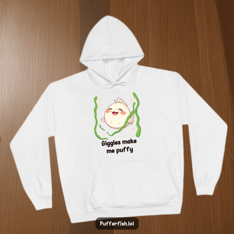 Funny hoodie featuring a pufferfish character in stitches, happily tickled by strands of seaweed, perfect for cozy, humorous wear.