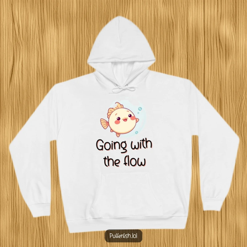 Funny kawaii pufferfish hoodie, playfully bouncing a big bubble, offering cozy comfort and underwater fun.
