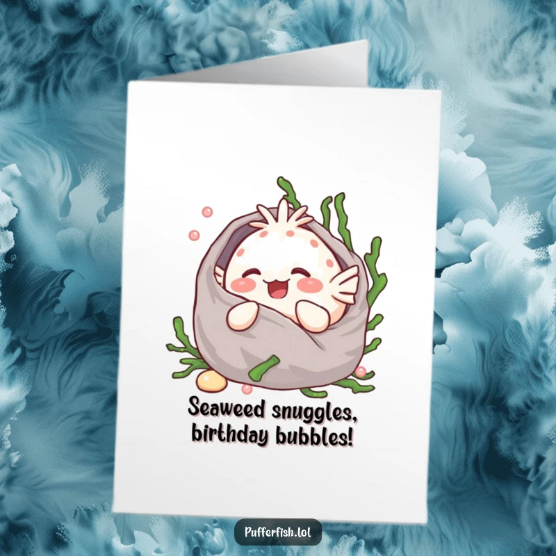 Funny Free Printable Birthday Card: Kawaii pufferfish giggling happily while snuggled in a soft seaweed blanket, ready for a birthday celebration.