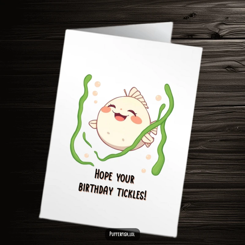Funny Free Printable Birthday Card: A pufferfish character laughing heartily as tickling seaweed playfully strokes its face.