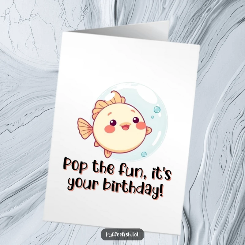 Funny Free Printable Kawaii Pufferfish Birthday Card bouncing a large bubble with playful delight.