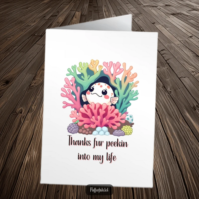 Funny Free Printable Thank You Card: A curious pufferfish peeking from behind a colorful coral reef, expressing thanks with intrigue.